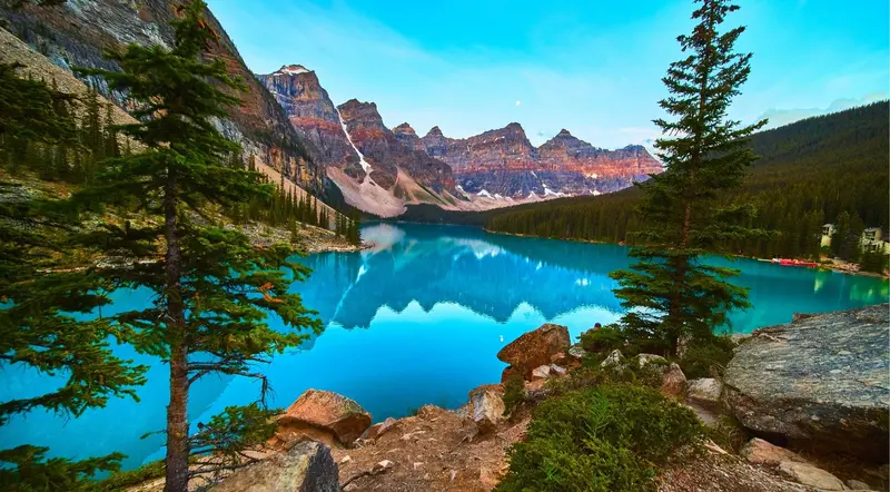 A turquoise glacial lake below mountains in the Canadian Rockies